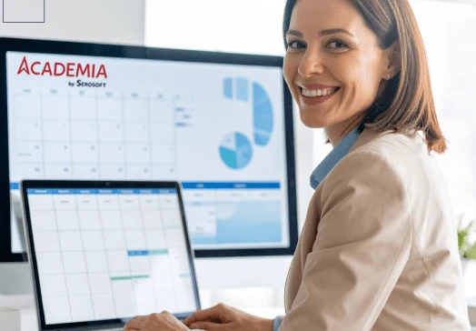 University administrator using a digital campus management system on a desktop